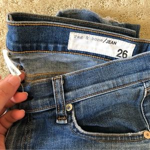 Skinny dark blue Rag and Bone jeans with rips in the knees